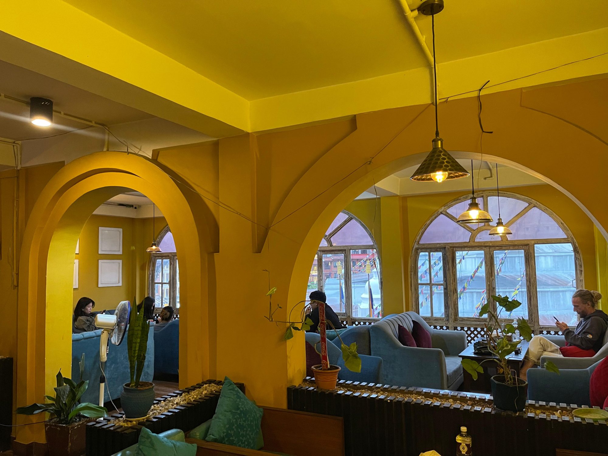 Yellow walls and arched windows in the second-floor lounge