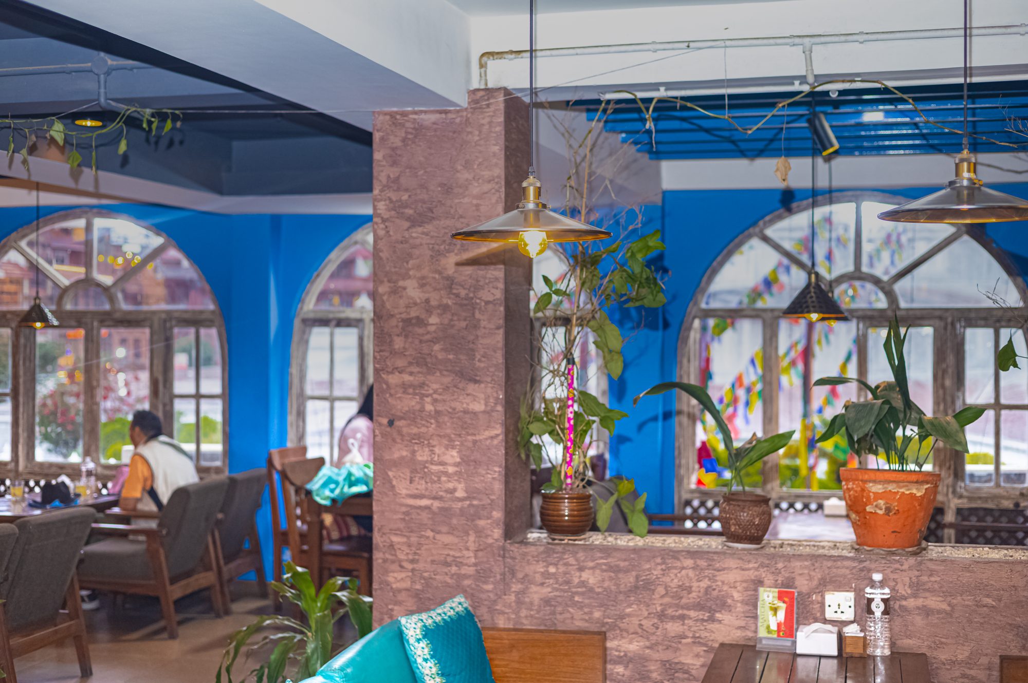 Blue arched windows — second-floor signature look